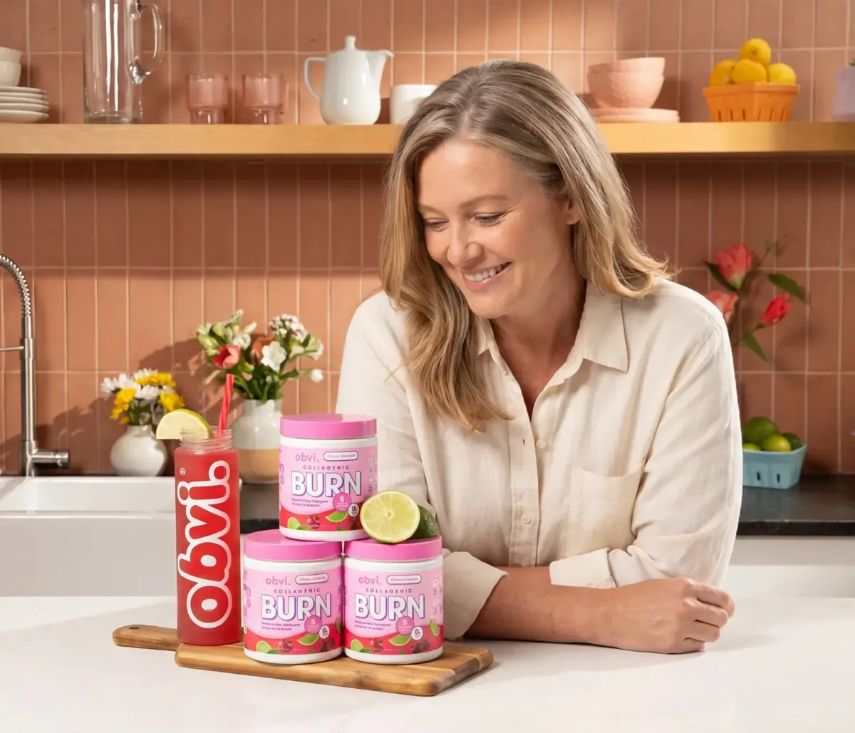 Woman holding Obvi Burn Powder